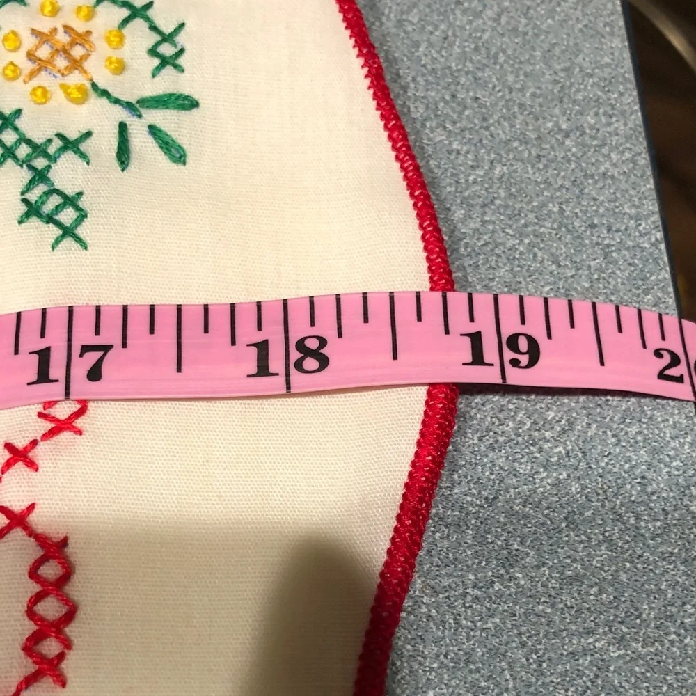 Embroidered Table Linens with Red Trim